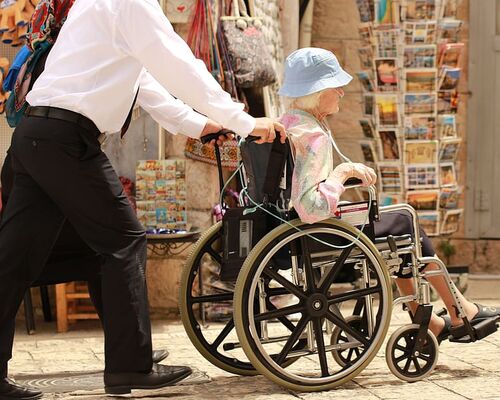 elderly-woman-sick-care-man-wheel-chair